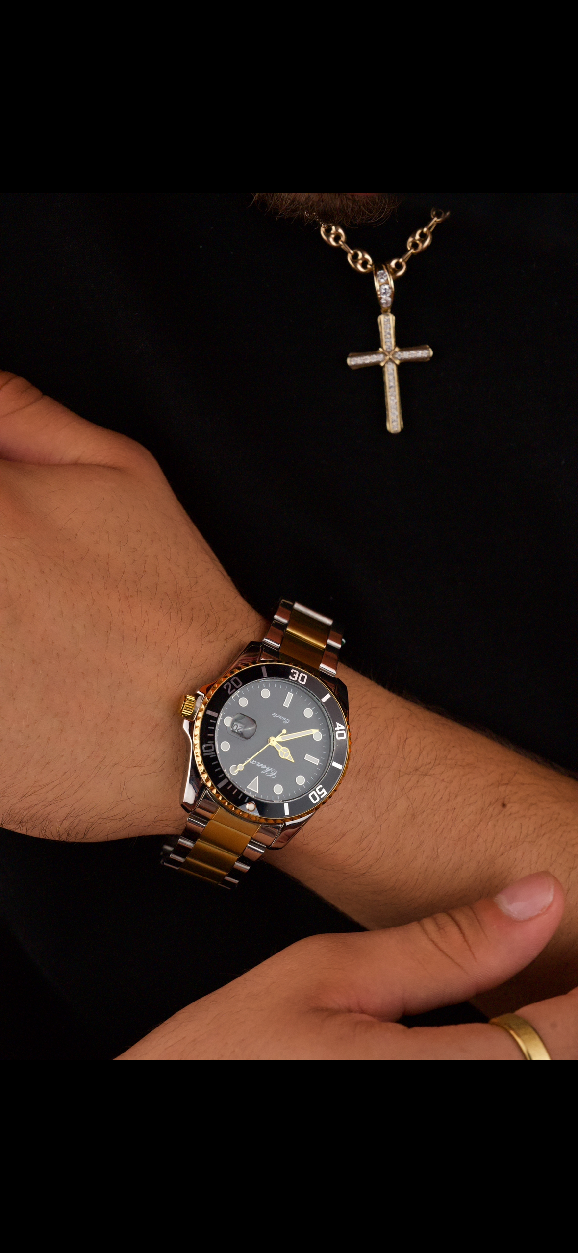 This is a Chenxi two-tone stainless steel quartz watch with a black dial and rotating bezel.