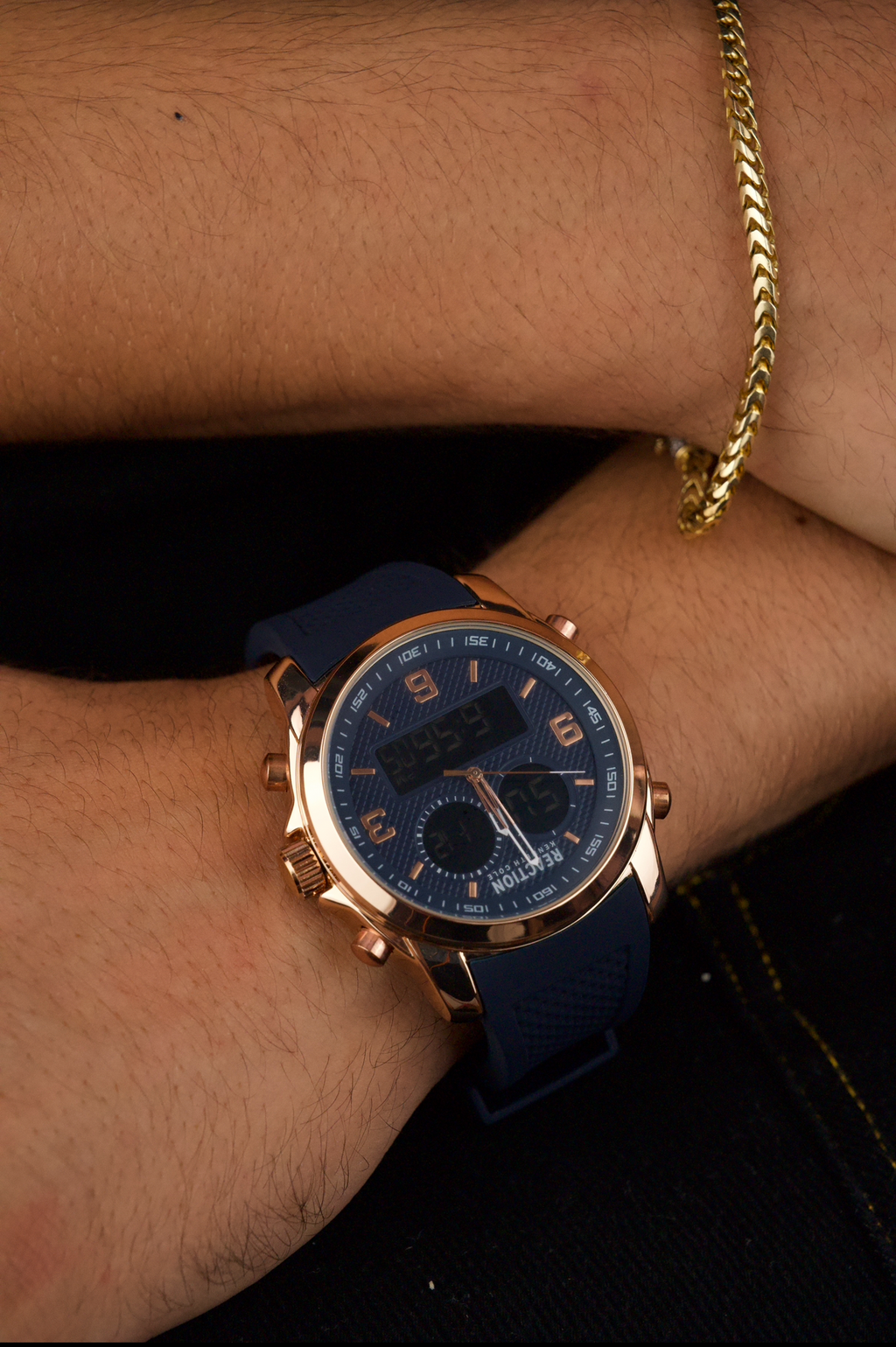 Kenneth Cole Reaction men's analog-digital watch with a rose gold-tone case and a blue silicone strap.