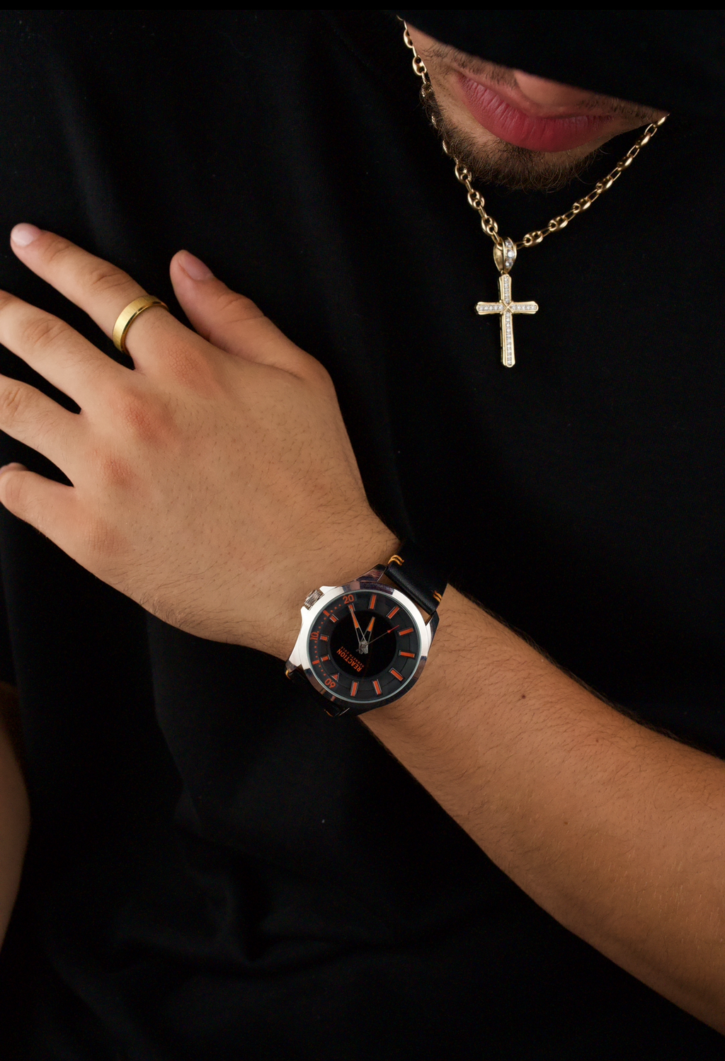 Kenneth Cole Reaction men's analog black leather strap watch with a black dial and orange accents