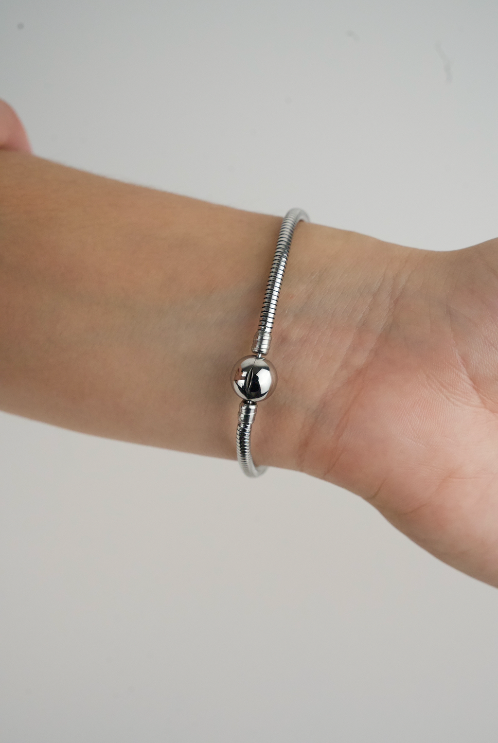 Metallic Red Heart Charm in stainless steel with hand-applied transparent red enamel.