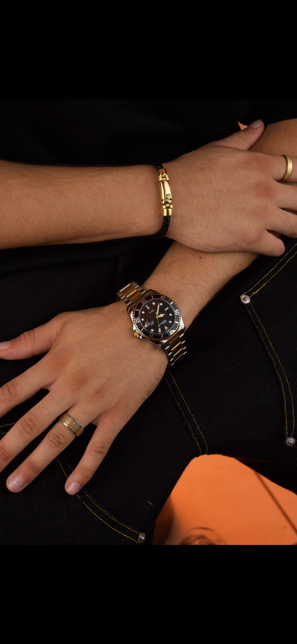 This is a Chenxi two-tone stainless steel quartz watch with a black dial and rotating bezel.